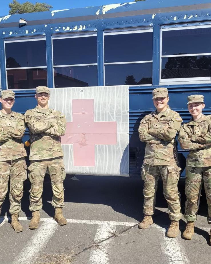 Nurse cadets in front of Red Cross bus